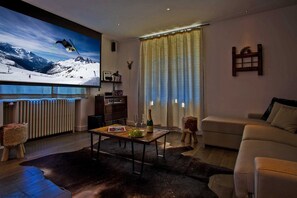 Lounge area with Cinema screen and projector for movie nights