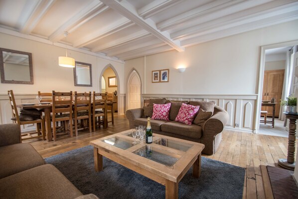 Open plan living room with arched doorways