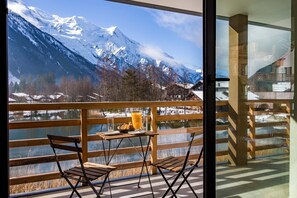 Floor to ceiling windows lead onto balcony