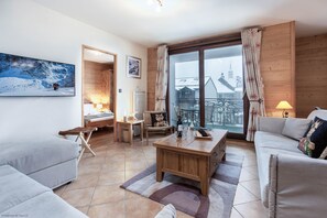 Open plan living room with full length doors
