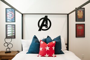 Stylish queen room with Marvel-inspired accents — cozy space for relaxing after a day in Washington, Utah