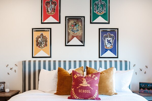 Colorful bedroom with playful themed bedding — ideal for kids and family stays.