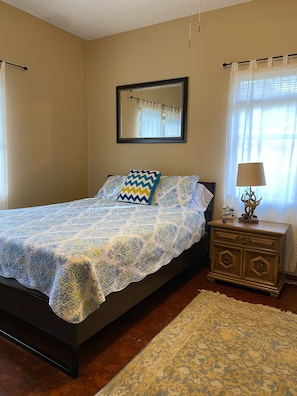 Primary bedroom with queen bed. 