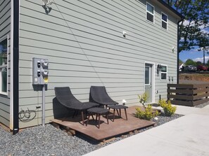 Patio beside the entrance door to the unit