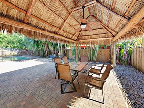 Escape to a tropical island resort with your own tiki hut in the back yard.