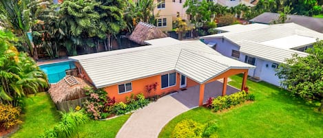 Welcome to Fort Lauderdale! This 3BR home features a landscaped pool area.
