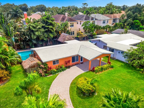 Welcome to Fort Lauderdale! This 3BR home features a landscaped pool area.