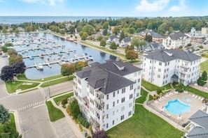 Aerial View - Aerial view of the building the condo is located within and courtyard with pool and hot tub