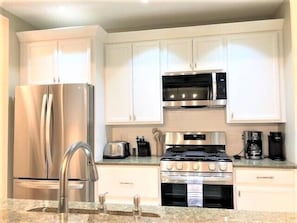 Kitchen - Brightly lit kitchen with all new appliances