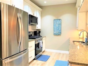 Kitchen - Brightly lit kitchen with all new appliances