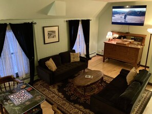Living room- 2 couches, Cocktail arcade game, Smart TV with Comcast.
