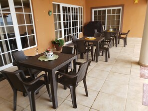 Patio outfitted with Gas BBQ, Tables & Chairs