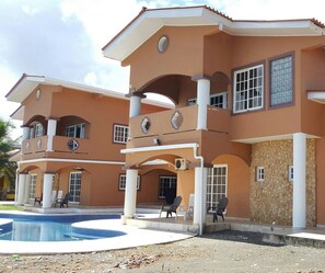 Side View of Huge Pool & Duplex