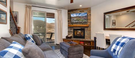 Parks Edge 13322: Living Room: "Cozy setup with a fireplace and a view to the patio."