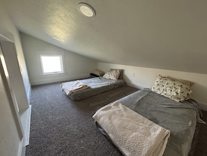 Loft sleeping space. 2 twin beds. 