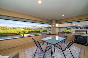 Enjoy the lake views from main level deck.  Gas BBQ, outdoor dining & love seat