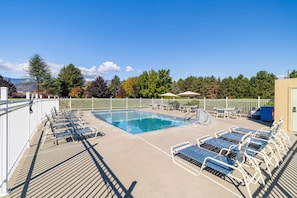 Condo is located next to the outdoor pool & spacious lawn areas