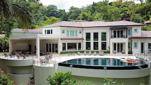 Casa Magnifica, has a large infinity pool jacuzzi  and rainforest drop that amaze you.