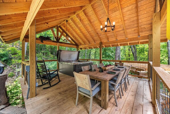 Private and covered outdoor hot tub and dining area!