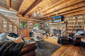 Updated living room furniture with fireplace and TV!