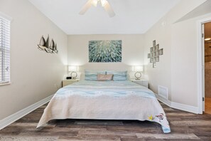 Master bedroom with a king-sized bed.
