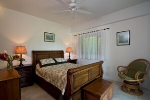 Queen Bed with views over pool and ocean