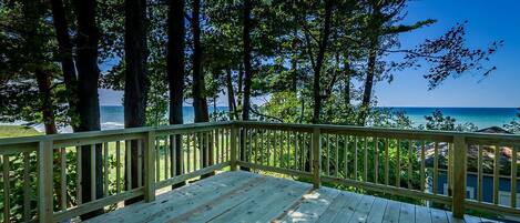 View off spacious deck from the entrance.  Outdoor table and chairs .