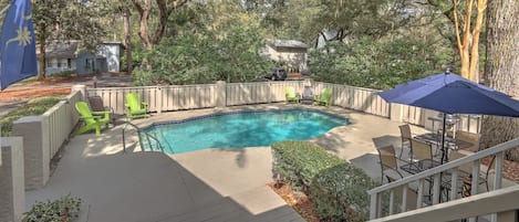 Private pool with outdoor furniture and charcoal Weber grill