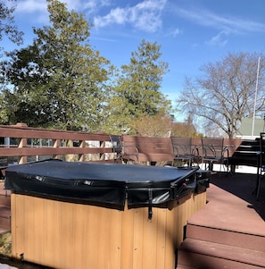 The hot tub and large deck are off the back of the house.