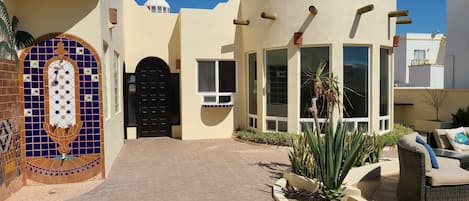 Private courtyard entry.
 Exterior shower. Shower the  Sand off and cool off.