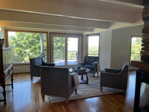 Living Room. Relax in comfortable club chairs by the ledge stone fireplace.