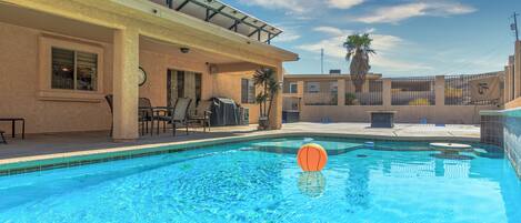 pool with shelf, table and shade