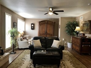 2nd Living Room with 40” smart TV 
Piano, guitar, and phonograph with records. 