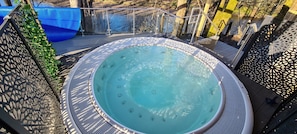 10 person covered spa tub with river view