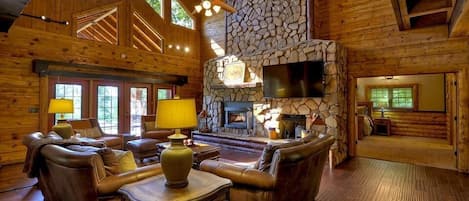 Welcome to Fox Run lodge!  Impressive Sitting Room with stone fireplace and high ceiling.