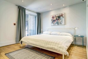 Bedroom 1: Dive into your plush king bed & you'll have blackout curtains too!