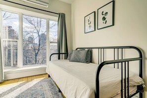 Bedroom 3, located at the end of the living area, features a twin daybed that can be converted into a larger bed using two twin-sized mattresses.