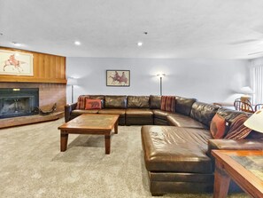 Cozy living room with fireplace to relax with friends &amp; family