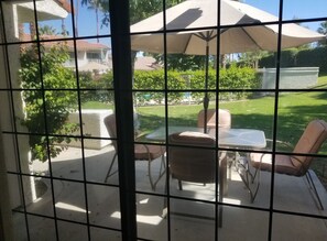 Steps across the terrace from the living room to the quiet pool and spa. 