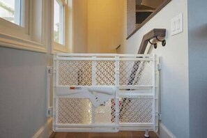 Baby gate at top of entry stair. 