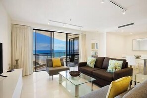 Lounge room with ocean & city views 