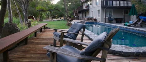 Riverside pool and multiple seating areas