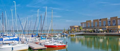 Water, Boat, Sky, Watercraft, Cloud, Vehicle, Building, Lake, Mast, Dock