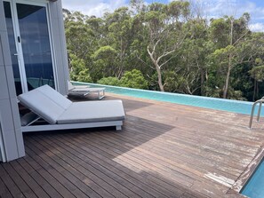 Pool deck and double sun bed 