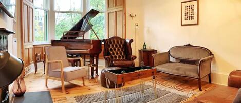 Classically decorated lounge area with grand piano