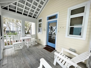 SCREENED IN, FURNSIHED FRONT PORCH AT ENTRANCE