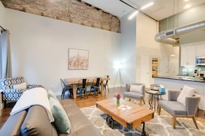 High ceilings and windows make this cozy space feel spacious and airy.