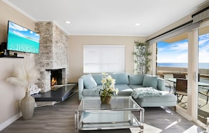 Beach view living room with flat screen TV