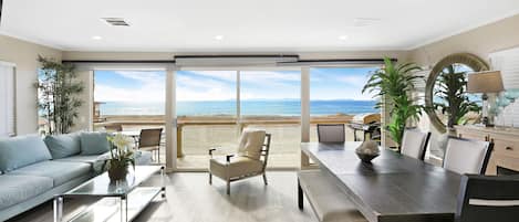 Beach view living room with flat screen TV