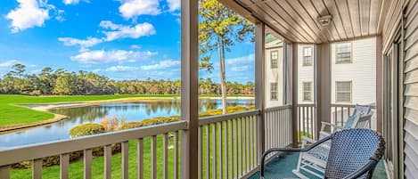 Enjoy refreshments from your porch overlooking the 4th hole of True Blue Golf 